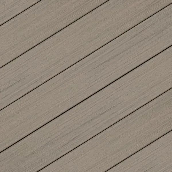 Diagonal view of weathered-looking gray composite decking boards.
