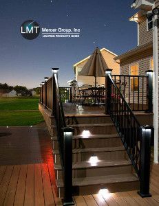 Deck with lit stairs and railing at dusk; LMT Mercer Group logo in the upper left.