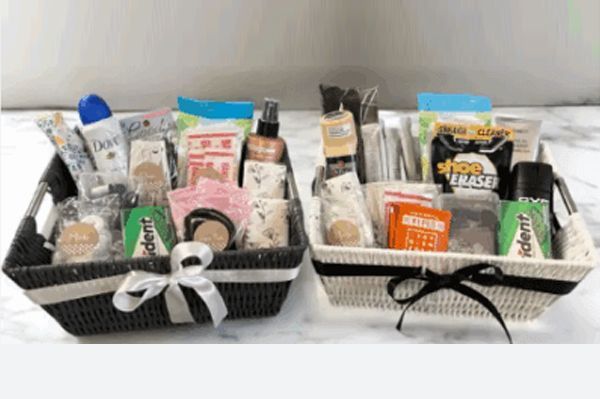 Two baskets filled with toiletries, tied with ribbons.