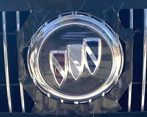 A Buick logo on the front of a car before