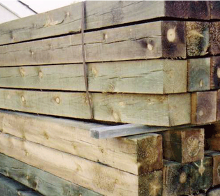 A pile of wooden beams stacked on top of each other