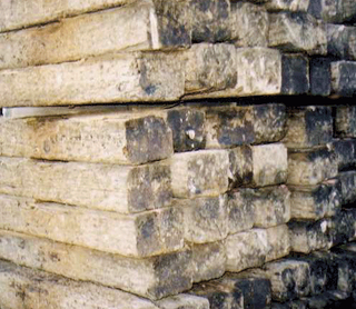 A pile of wooden blocks stacked on top of each other.