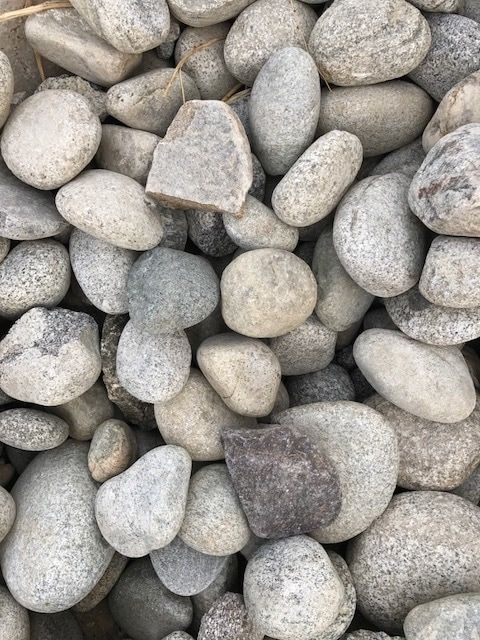 A pile of rocks is sitting on top of each other on a table.