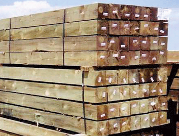 A pile of wooden beams stacked on top of each other