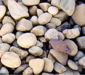 A pile of rocks with a brown rock in the middle