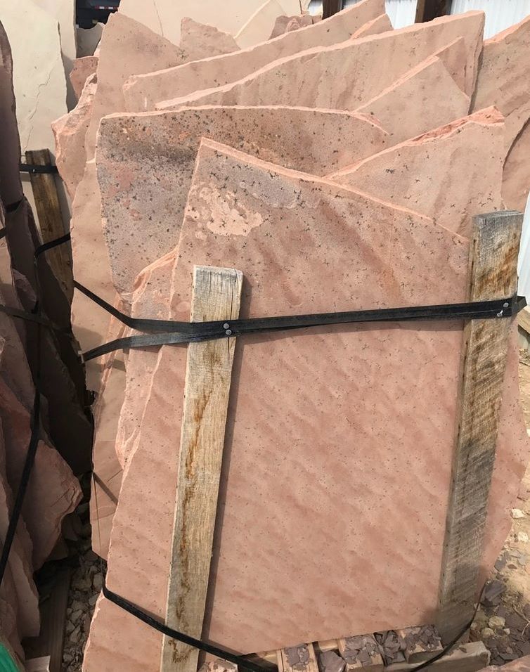 A pile of rocks tied together with a black strap.