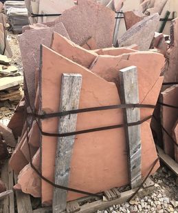 A pile of rocks stacked on top of each other on a wooden pallet.