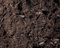 A close up of a pile of brown mulch.