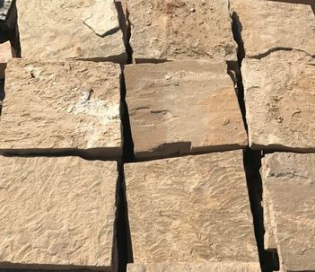 A pile of bricks sitting on top of each other on a table.
