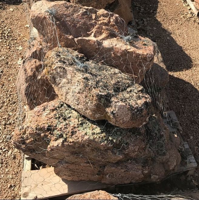 A pile of rocks sitting on top of a wooden pallet