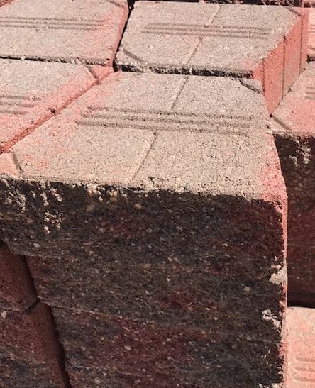 A close up of a pile of bricks stacked on top of each other.