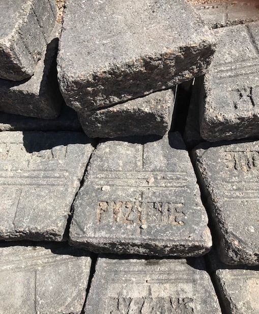 A pile of bricks with the letters ryz on them