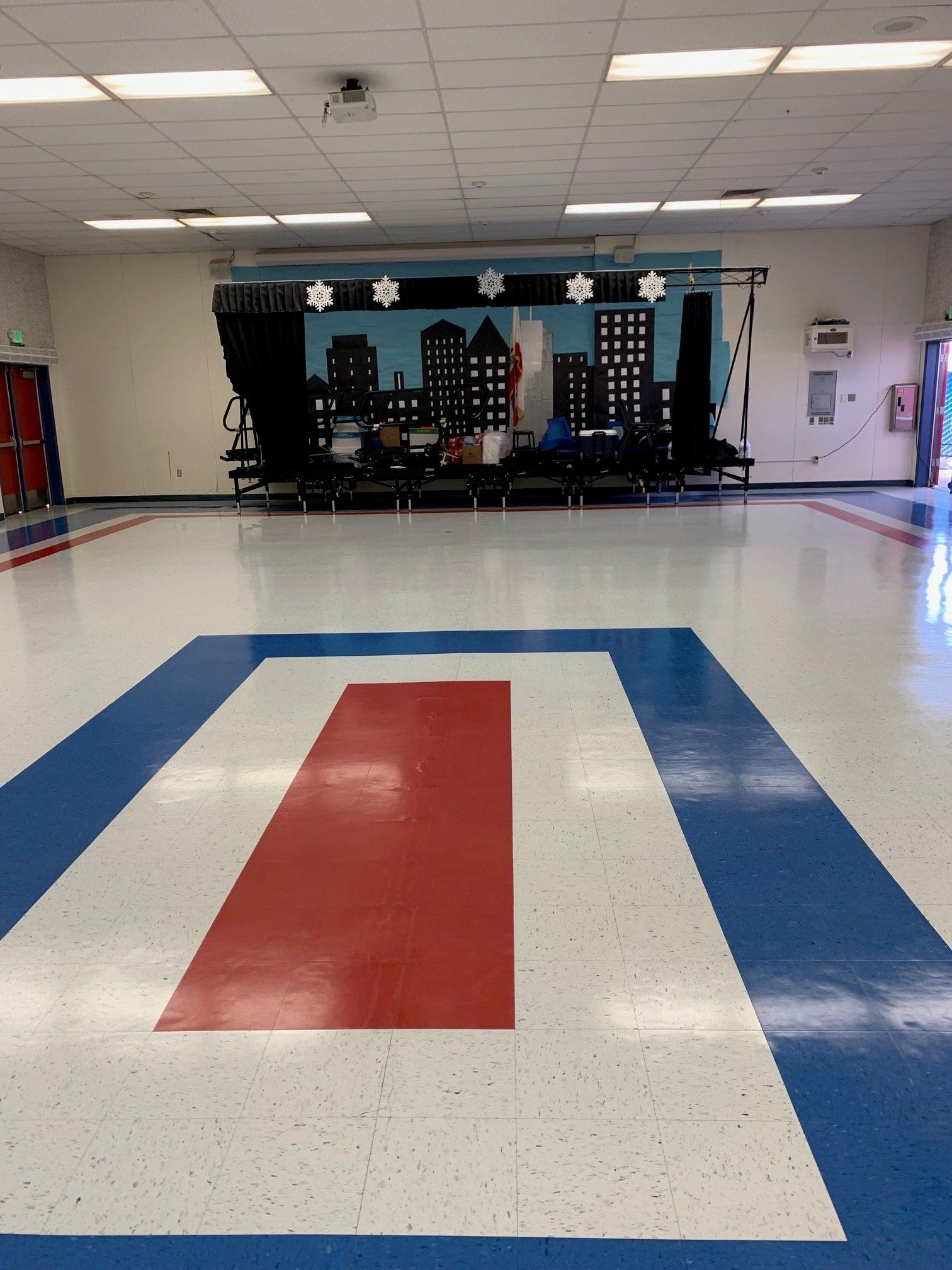 A large room with a red white and blue floor