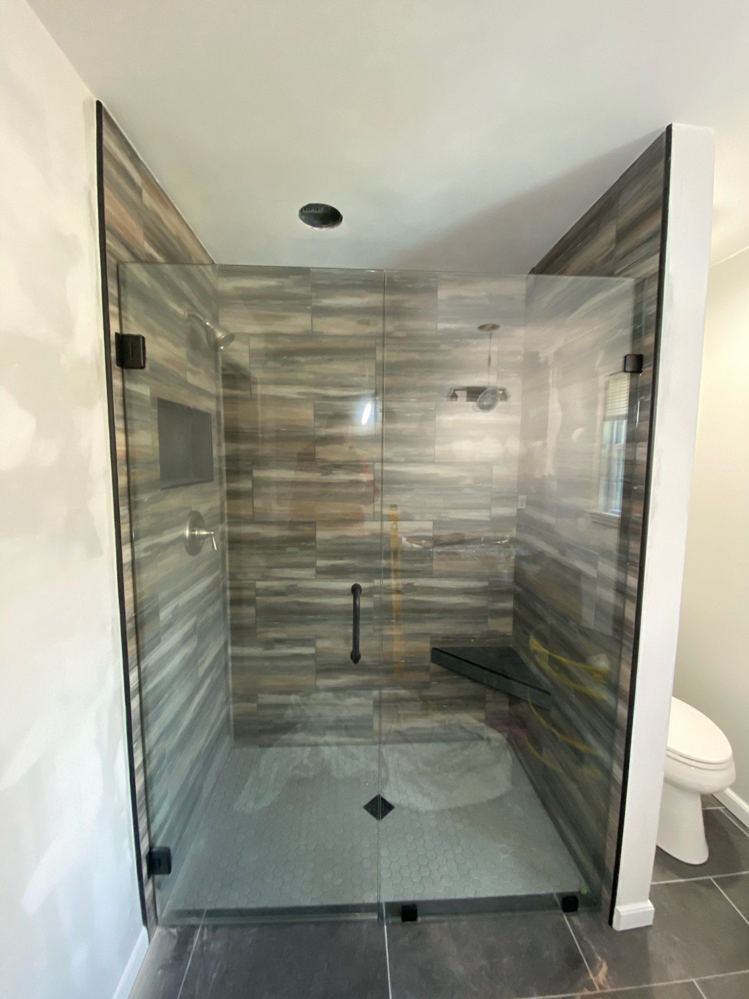 a bathroom with a walk in shower