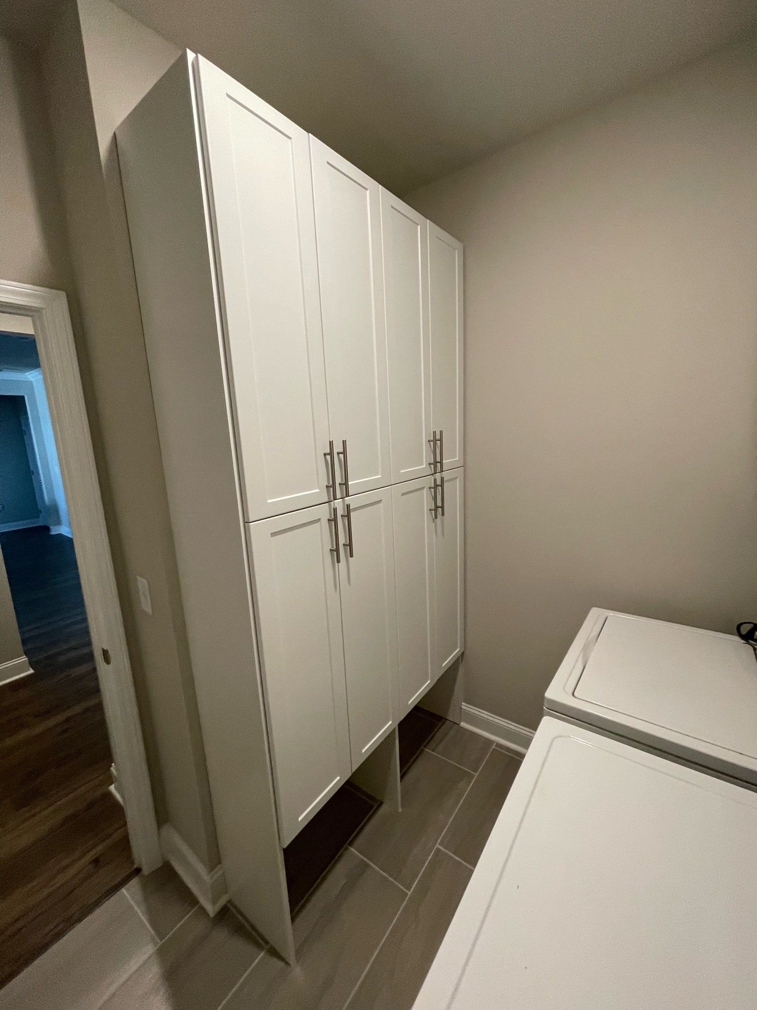 a room with a large white cabinets