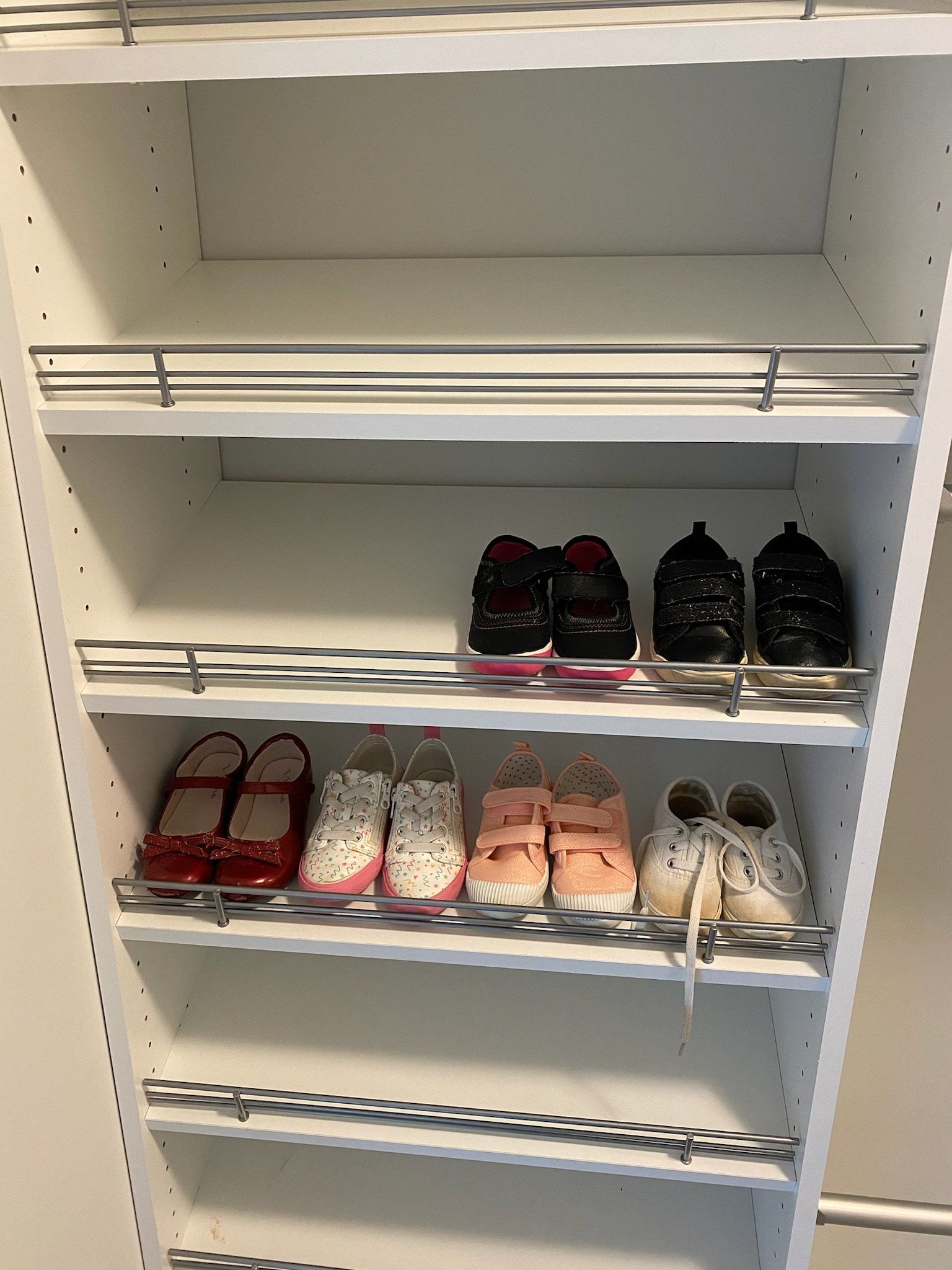 a closet filled with lots of shoes and slippers