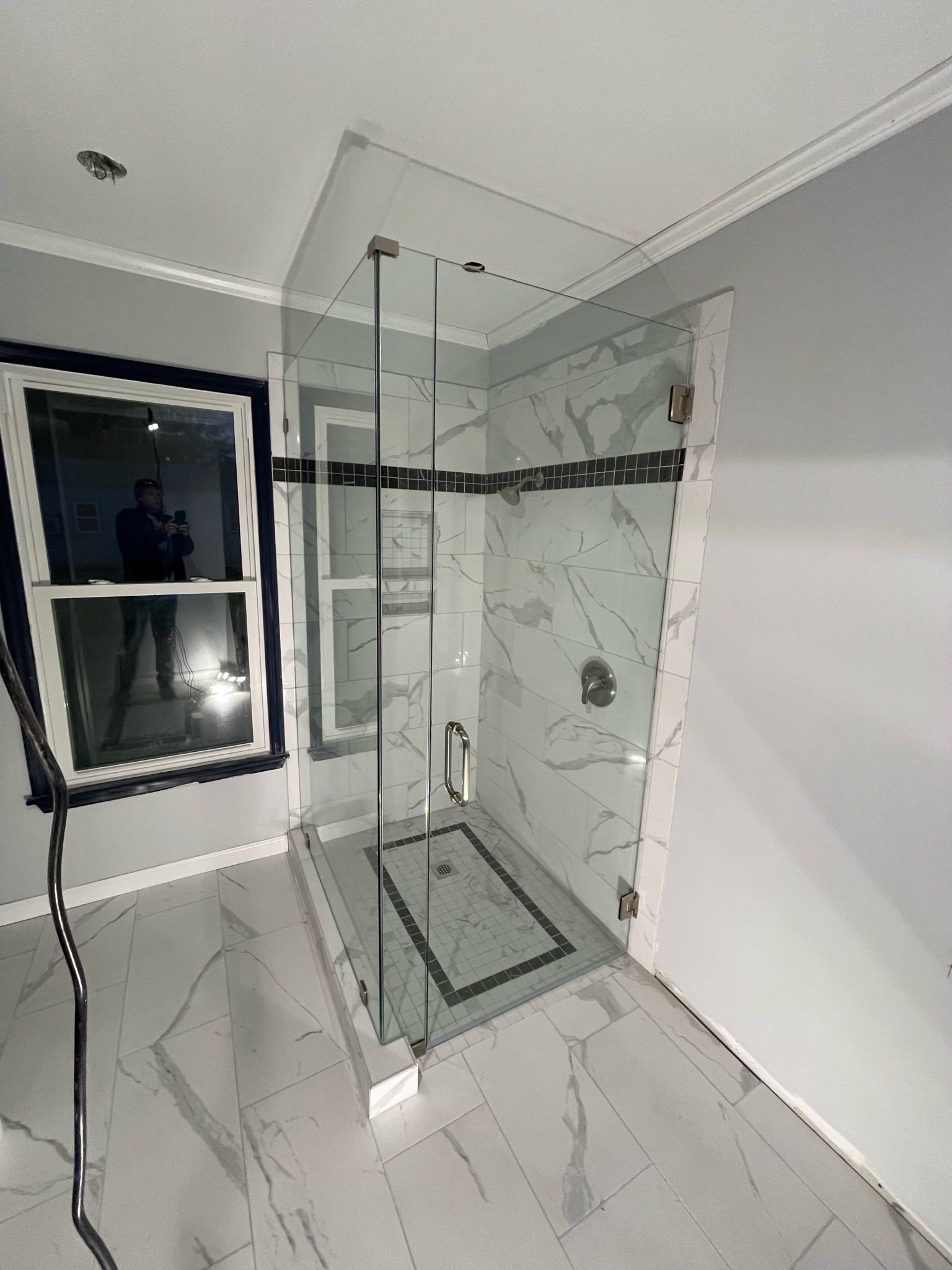 a bathroom with a walk in shower