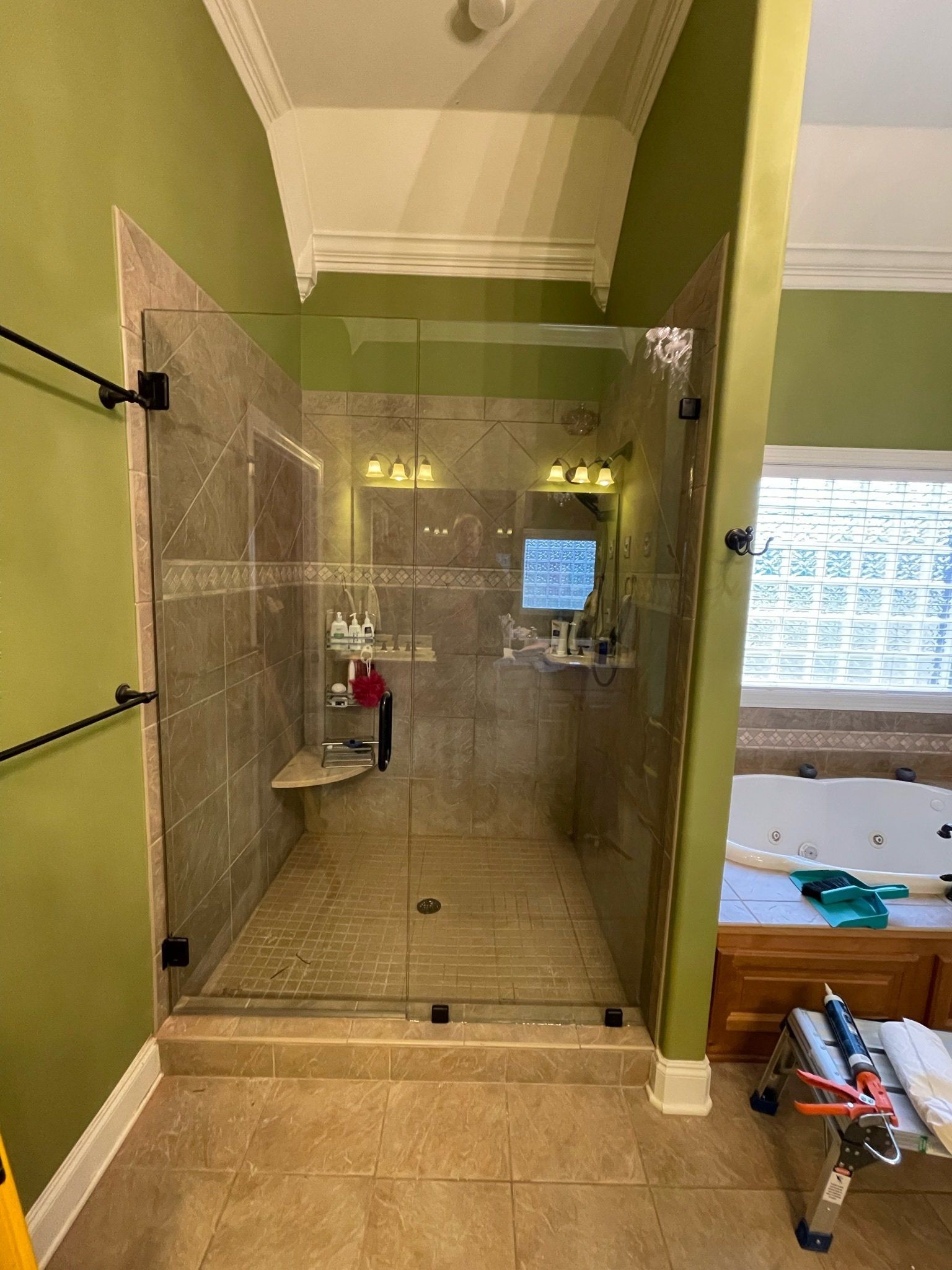 a bathroom with a walk in shower and a jacuzzi tub