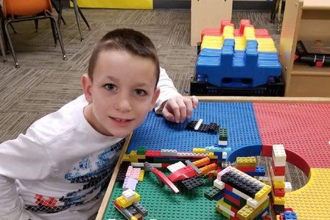 Boy playing lego