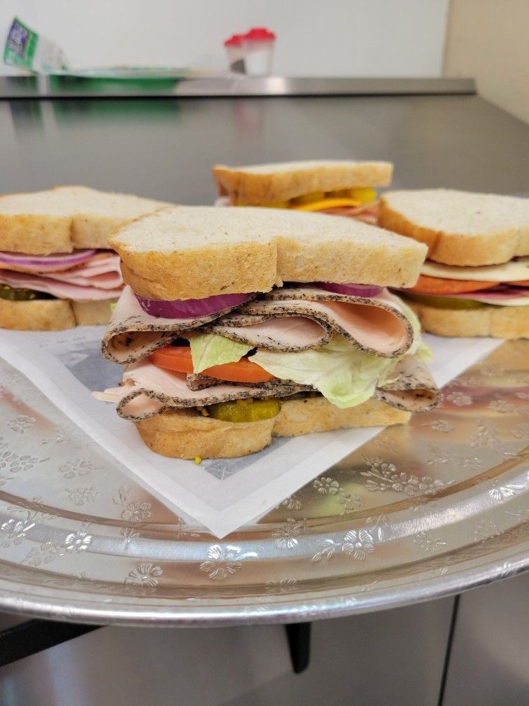 A close up of a sandwich on a plate on a table.