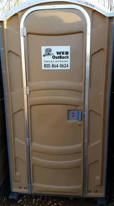 Tan porta-potty with silver door frame and company logo on door.