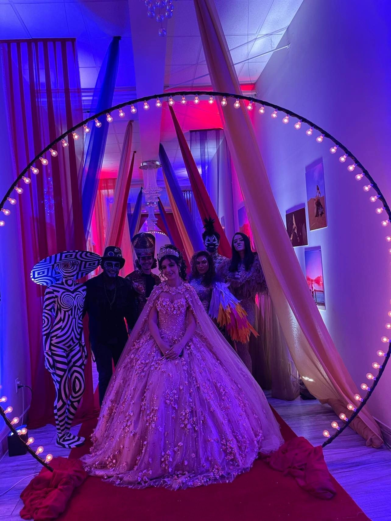 A large room with tables and chairs set up for a wedding reception.