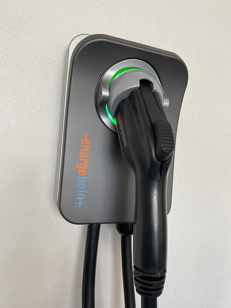 A close up of a charging station on a wall