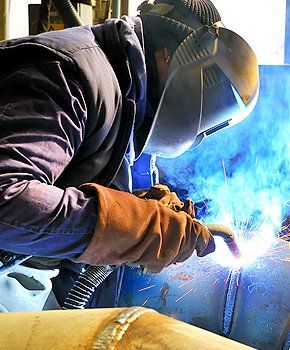 Man welding with mig-mag method