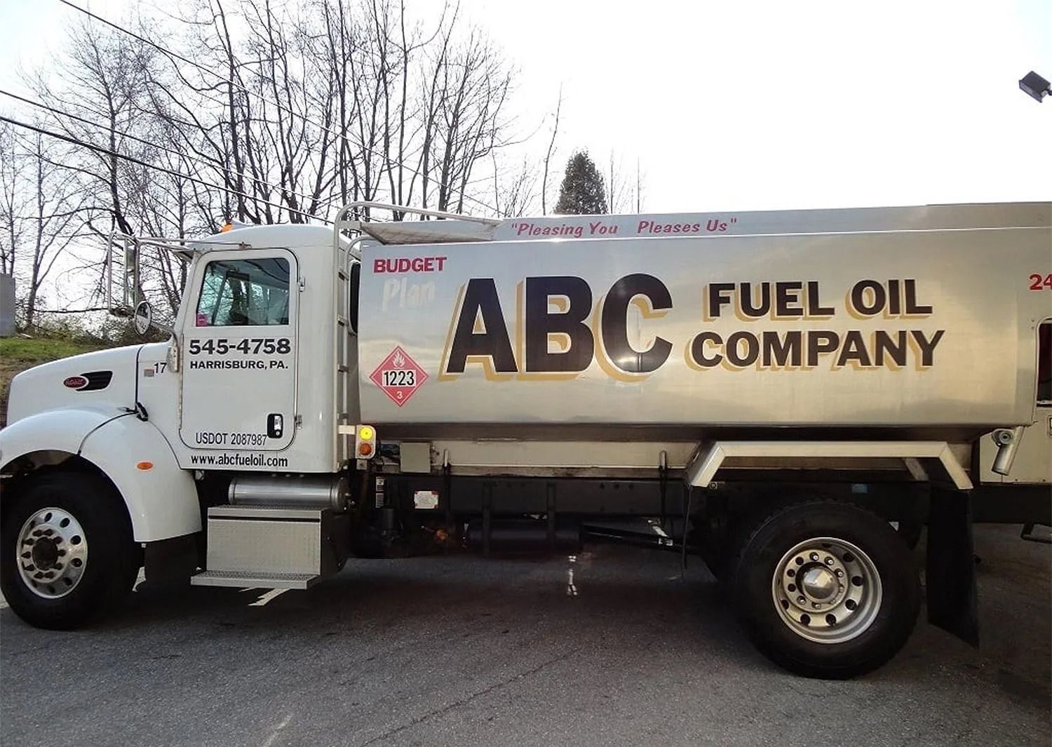 White ABC Fuel Oil Company truck parked on pavement.