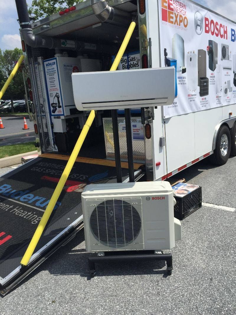 Bosch air conditioning unit display outside a trailer. White, with the outdoor unit at the base.