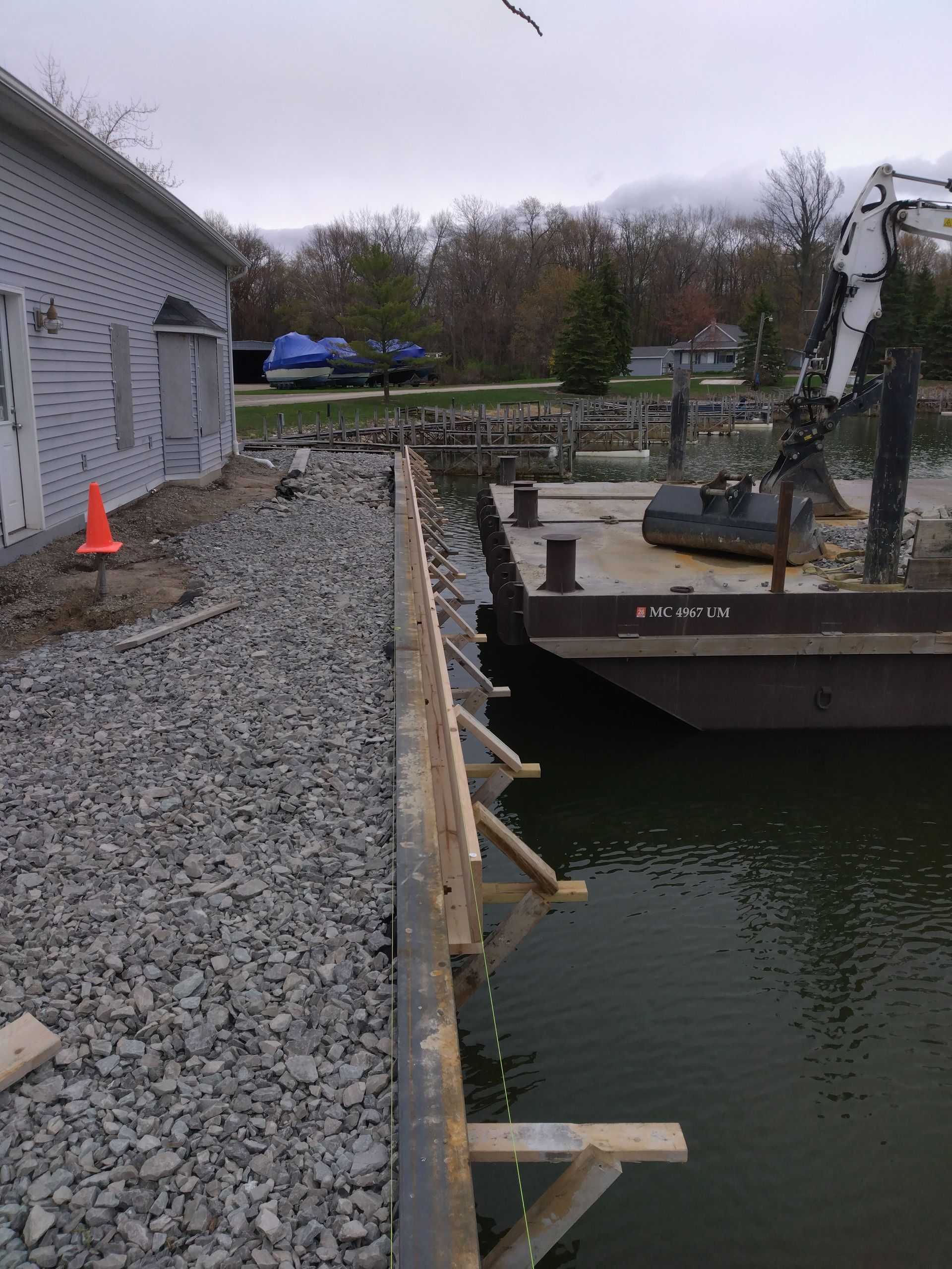 a boat is docked in a body of water near a building