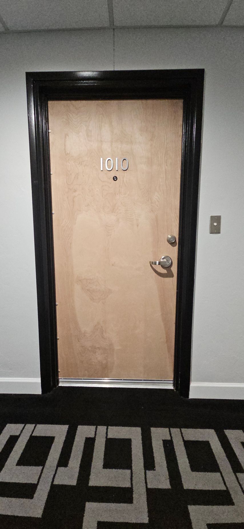 A wooden door with the number 