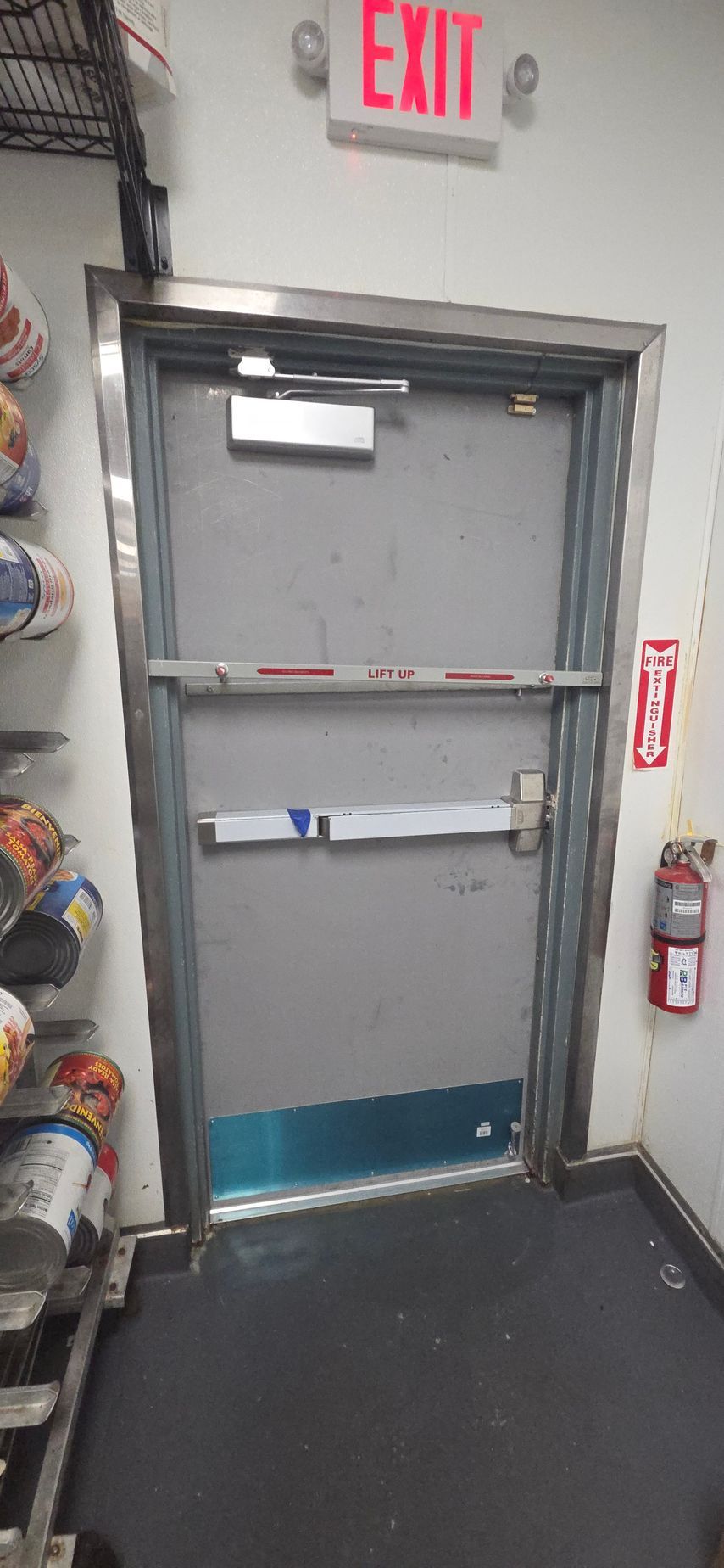 An exit door with a red 