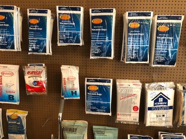 A variety of cleaning products are displayed on a wall