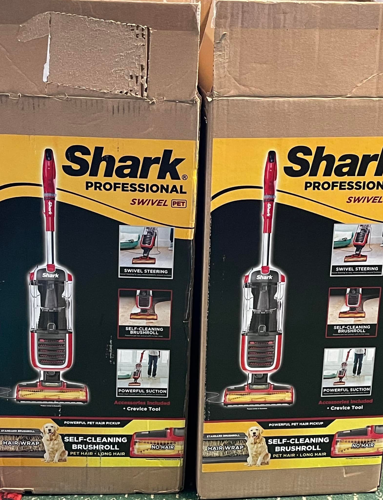 Two boxes of shark professional vacuum cleaners