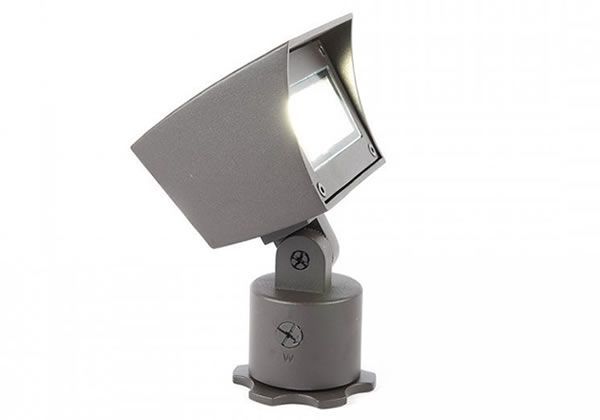 Bronze-colored adjustable outdoor spotlight illuminating a white square light.