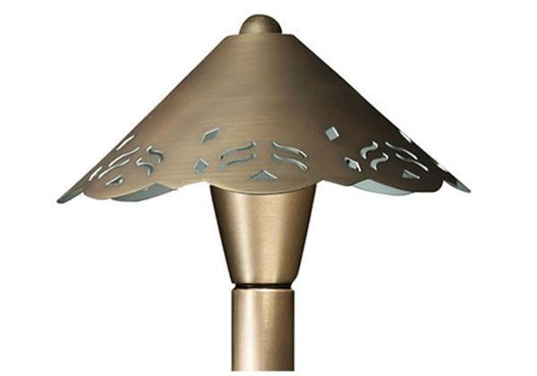 Bronze landscape path light with decorative cutout shade.