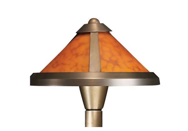 Bronze outdoor post light with amber-colored shade.