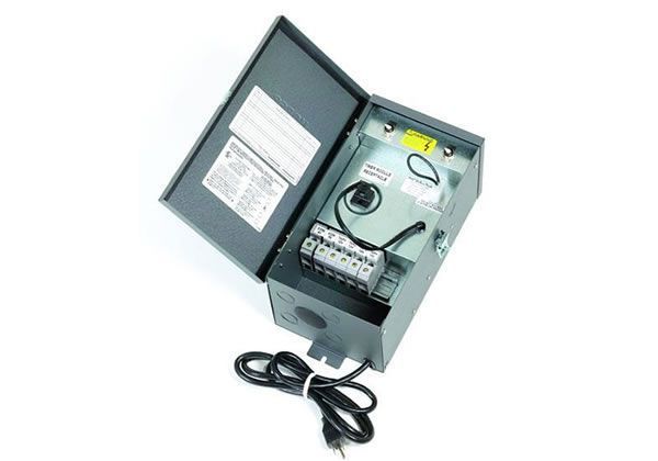 Gray electrical transformer box with the door open, showing wiring and a power cord.