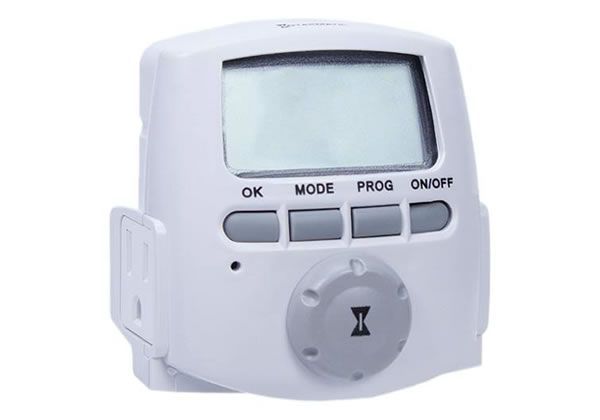 White digital timer with an LCD screen, four buttons, and a dial.