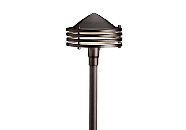 Bronze outdoor pathway light with a tiered shade and pyramid top.