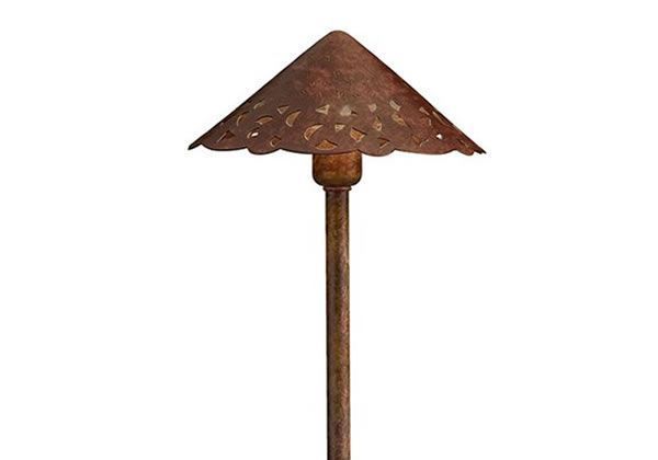 Rusty brown outdoor landscape light with decorative canopy.