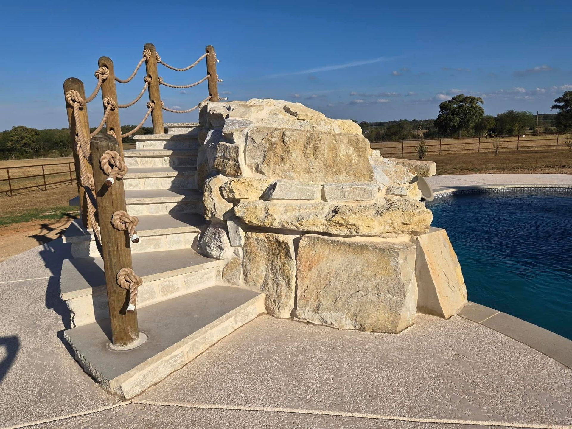 A set of stairs leading up to a swimming pool.