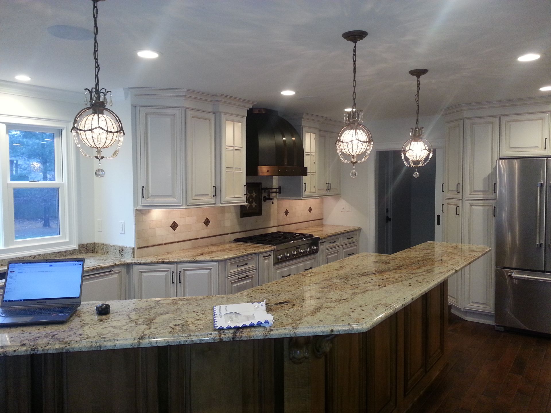 A kitchen with stainless steel appliances and granite counter tops