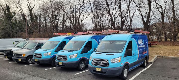 A blue van for wave electric company llc is parked in a parking lot