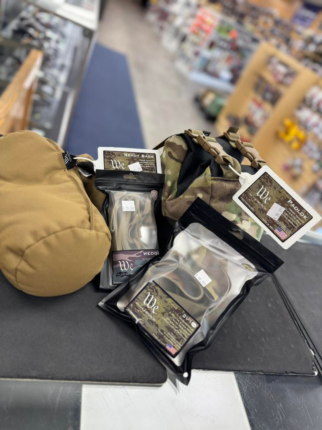 Assorted packaged items and a tan hat displayed on a store counter in a retail aisle