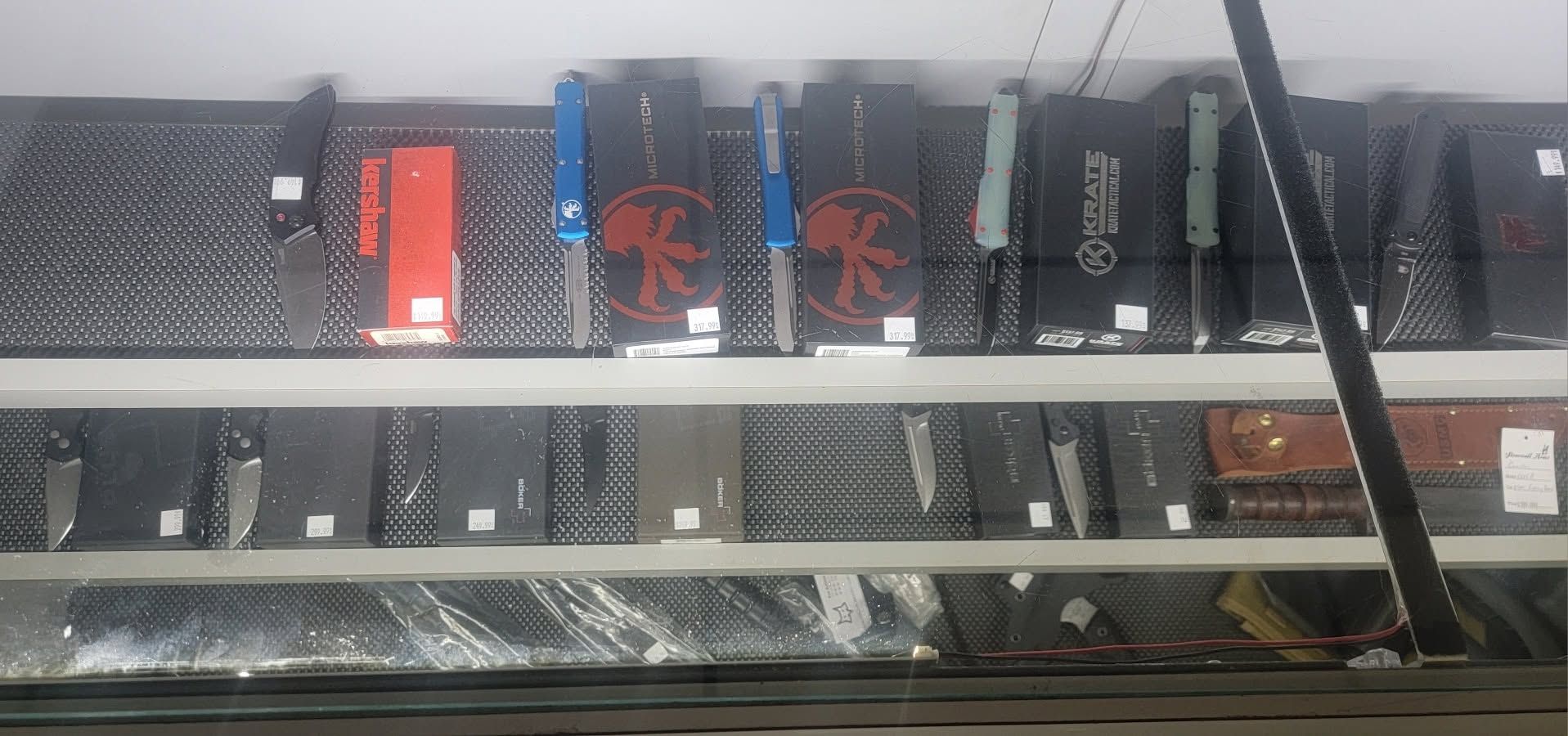 Row of electrical control boxes and wiring mounted on a metal rack inside an industrial panel.