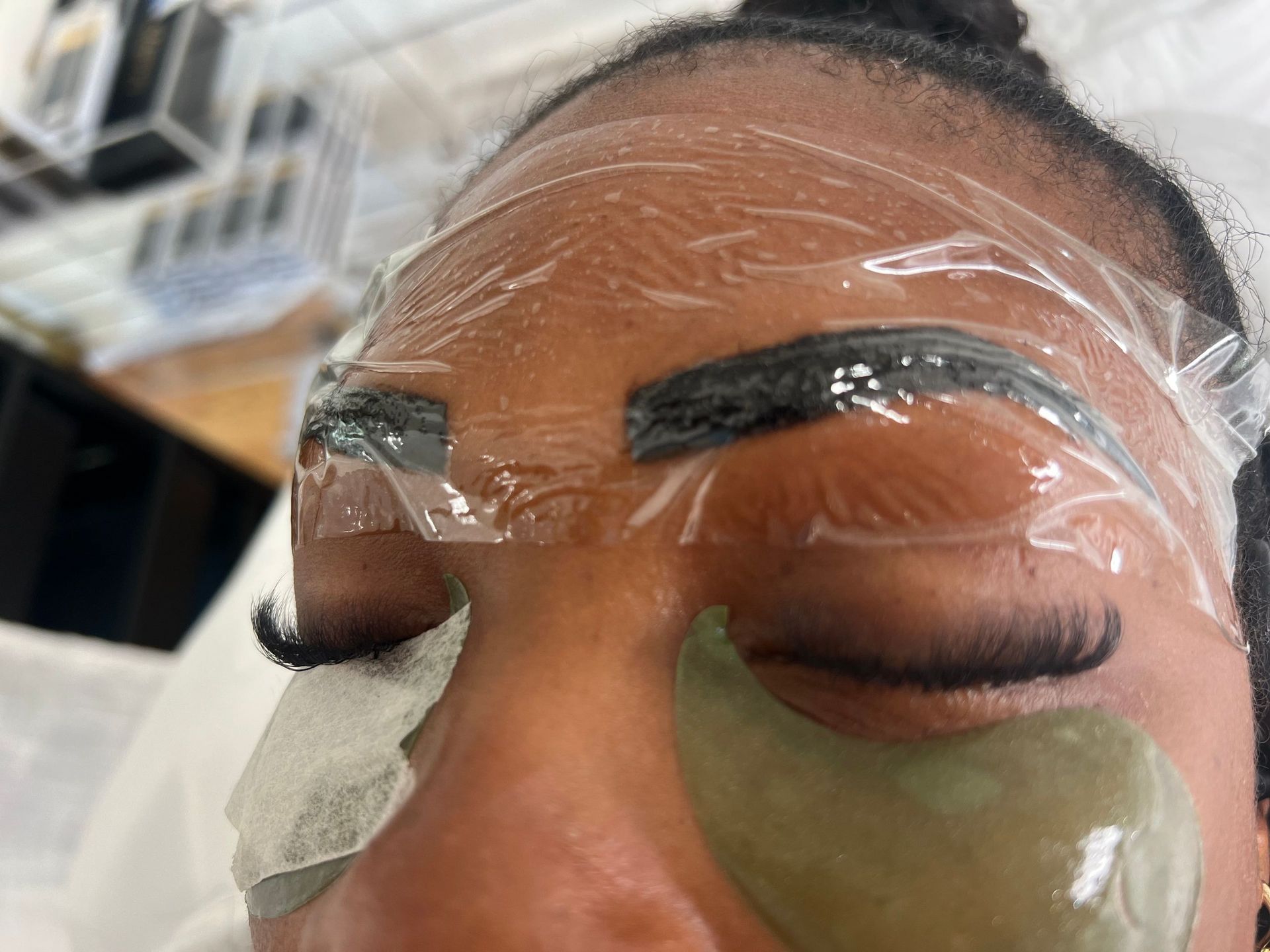 A close up of a woman 's face with a mask on it.