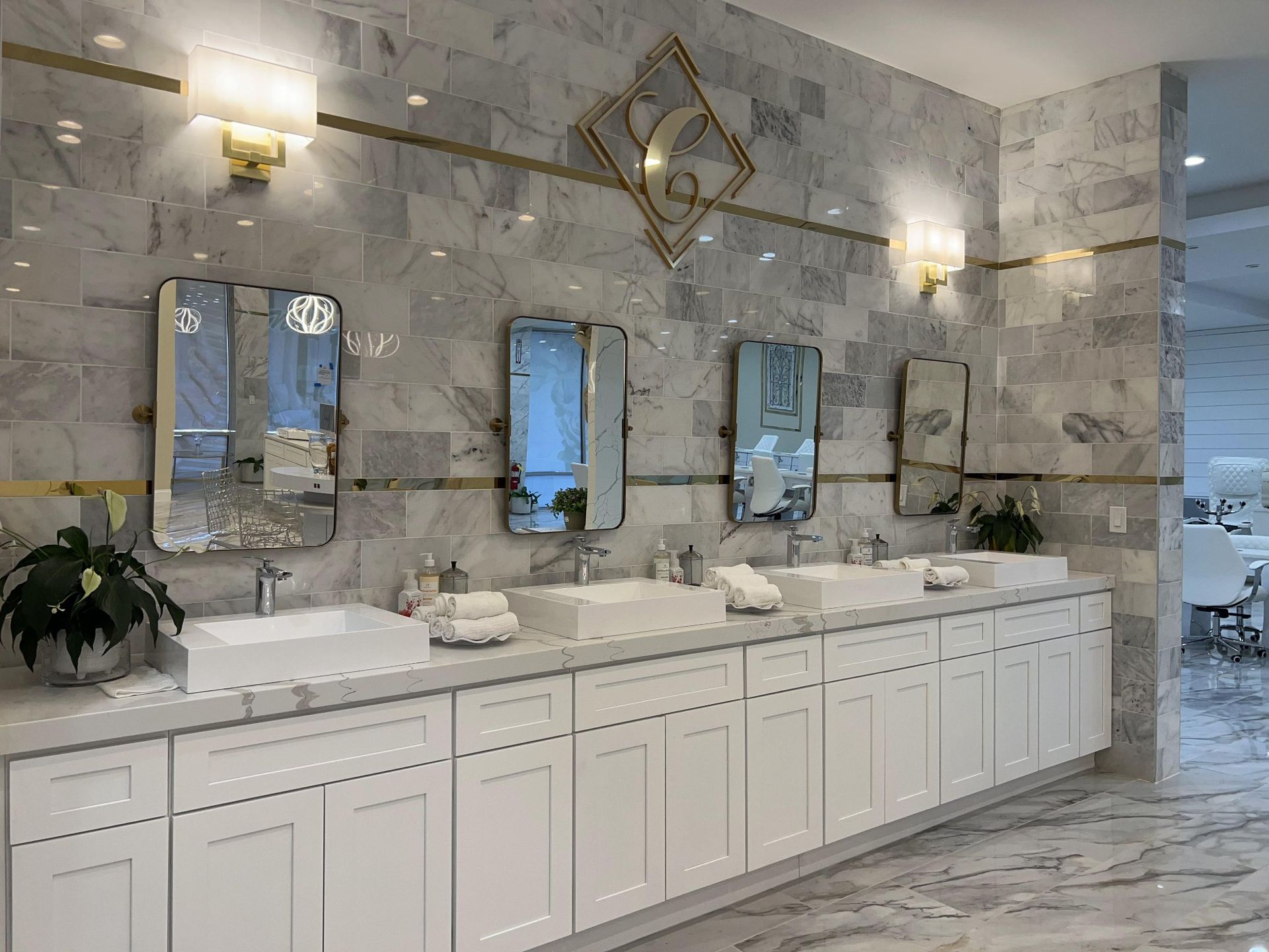 A bathroom with a lot of sinks and mirrors.