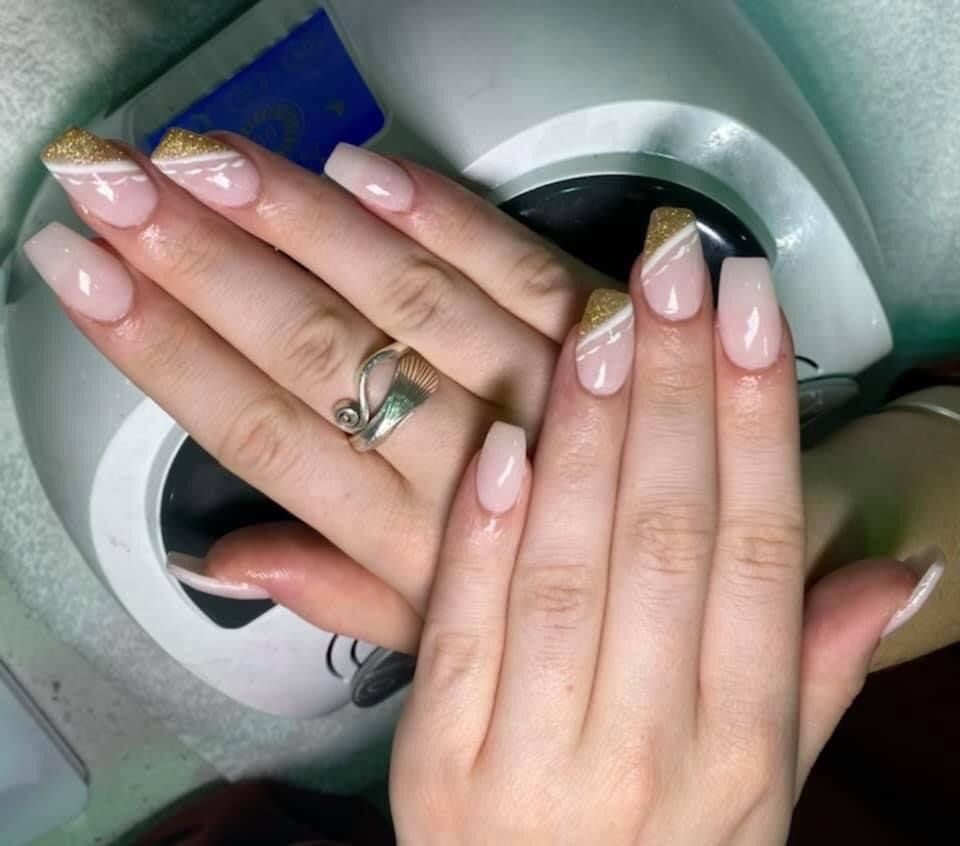 A close up of a woman 's hand with a ring on her finger.